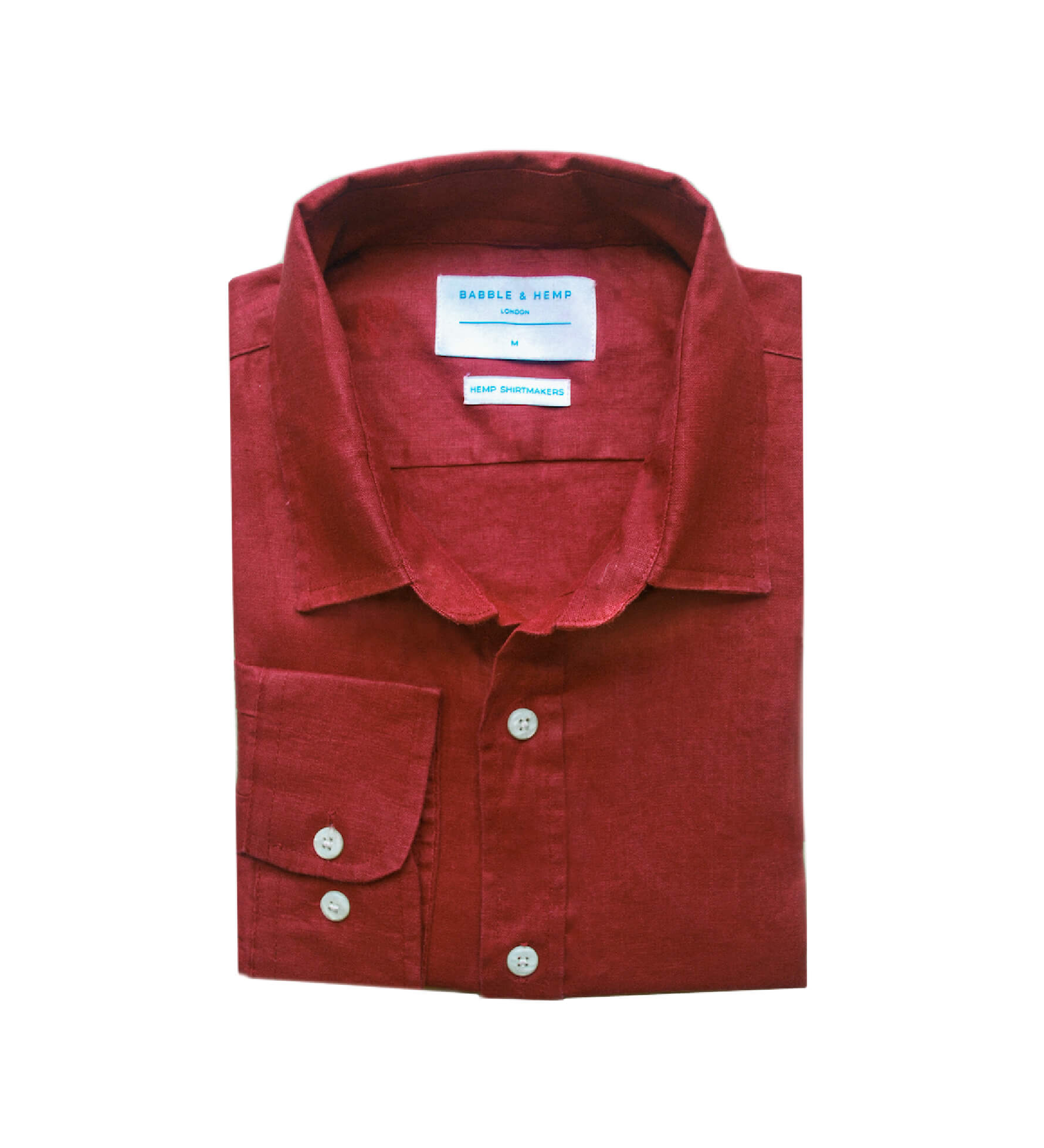 Folded red shirt made from sustainable hemp fabric with a label on a white background