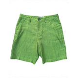 Green hemp shorts laid flat on a white background