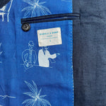 Close-up of interior lining showing blue fabric with white patterns and a brand label.