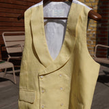 a yellow hemp waistcoat designed for weddings or royal ascot hanging on a washing line