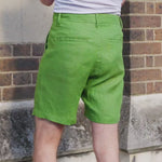 A video showing close up footage of a pair of green hemp shorts so that the viewer can understand how the fabric behaves with movement
