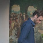 a video of a model wearing a navy blue hemp shirt