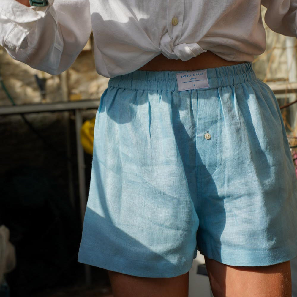 man wearing light blue hemp boxer shorts