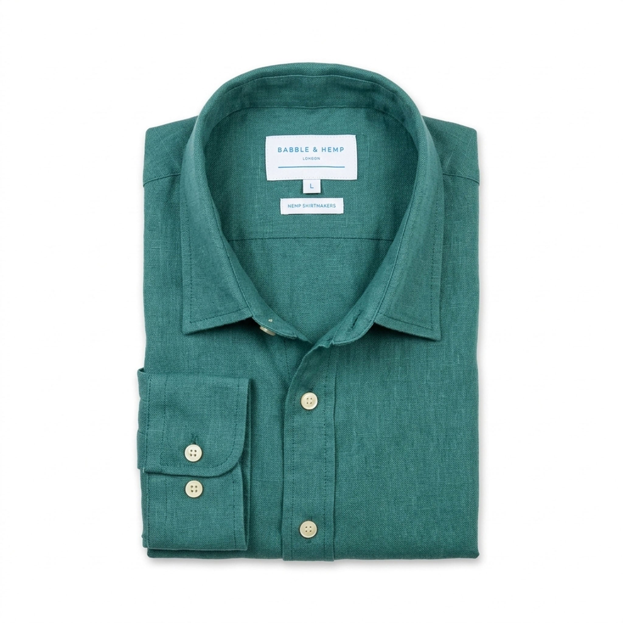 A folded green long-sleeve hemp  shirt with collar, shown on a plain white background. The inner neck label reads 'BABBLE & HEMP'.