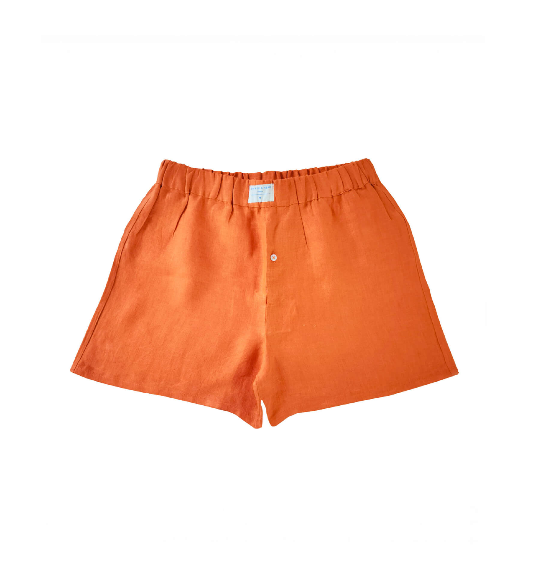 Orange hemp boxer shorts laid flat on a white background