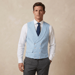 a mid thirties man wearing a light blue coloured double breasted wedding waistcoat made from hemp fabric