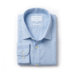 A light blue long-sleeve dress shirt made from hemp fabric by Babble & Hemp, neatly folded with the collar and left cuff turned up, on a clean white background.