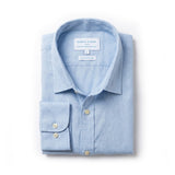 A light blue long-sleeve dress shirt made from hemp fabric by Babble & Hemp, neatly folded with the collar and left cuff turned up, on a clean white background.