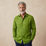 Man wearing a green hemp shirt against a beige background
