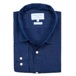 Folded blue shirt with a visible brand label on a white background