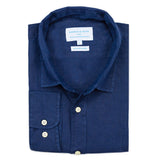 Folded blue shirt with a visible brand label on a white background