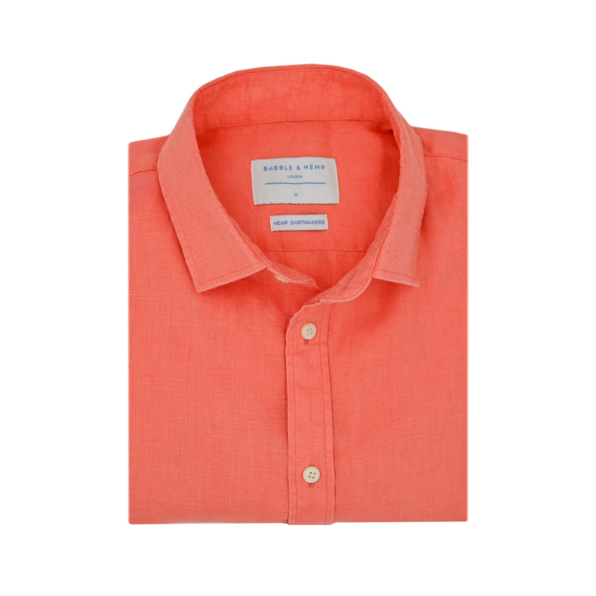 the front, primary e-commerce shot from the top down of a folded coral coloured hemp shirt on a plain white background