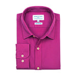 Product shot of folded purple hemp shirt with a label on a white background