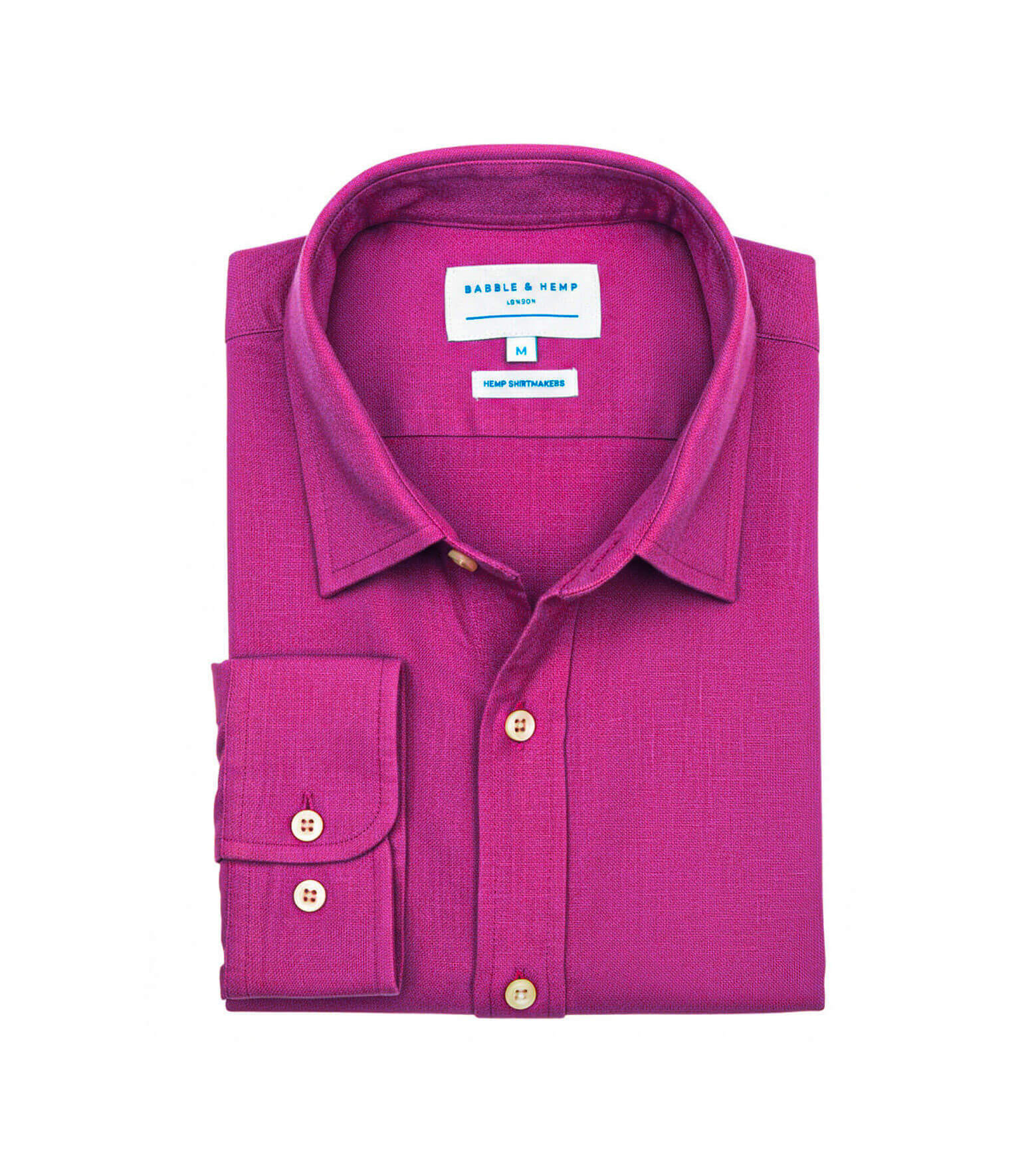 Product shot of folded purple hemp shirt with a label on a white background