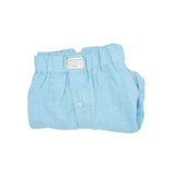 Folded light blue hemp boxer shorts with a visible brand label on a white background