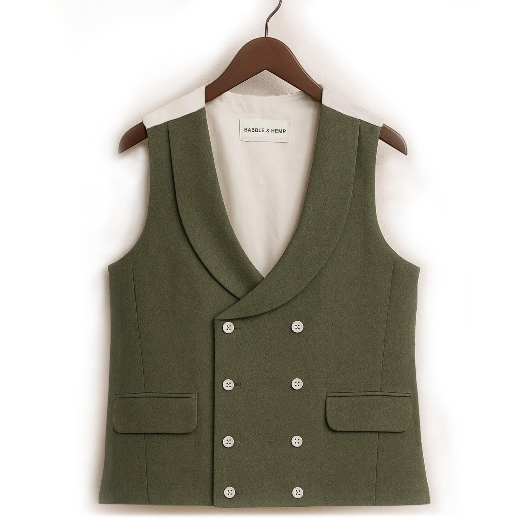 green hemp waistcoat worn to weddings or royal ascot hangs from Wooden hanger