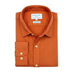 Product shot of orange hemp shirt with a collar label on a white background