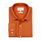 Product shot of orange hemp shirt with a collar label on a white background
