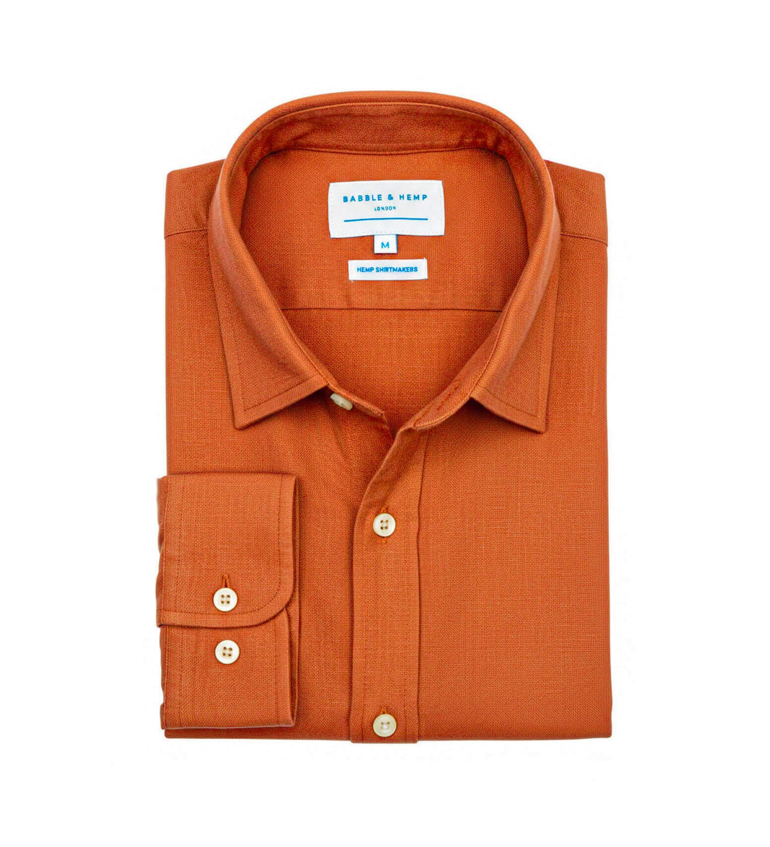 Product shot of orange hemp shirt with a collar label on a white background