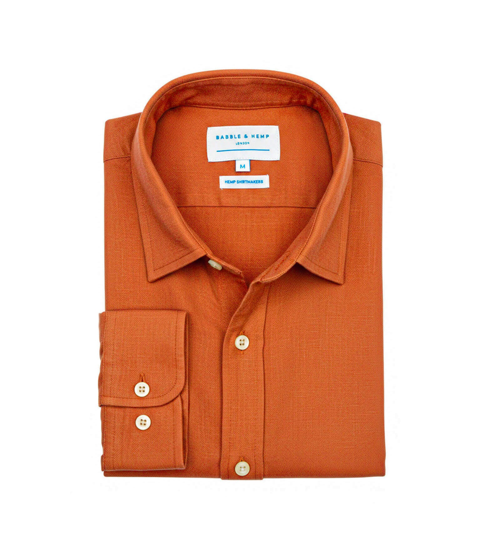 Product shot of orange hemp shirt with a collar label on a white background