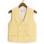 yellow waistcoat made from hemp fabric on hanger in front of white background