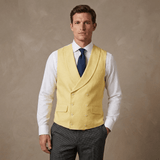 man wearing a yellow double breasted waistcoat made of hemp fabric in front of a beige background