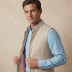 Man wearing a light blue shirt and beige nehru gilet made of hemp against a beige background