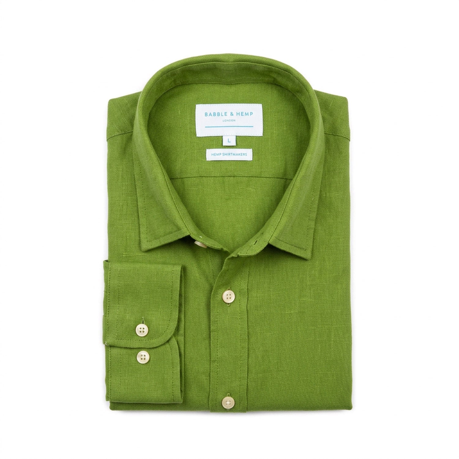 A folded green hemp shirt by Babble & Hemp, featuring a classic collar, button-down front, and a single-button cuff, displayed on a clean white background.