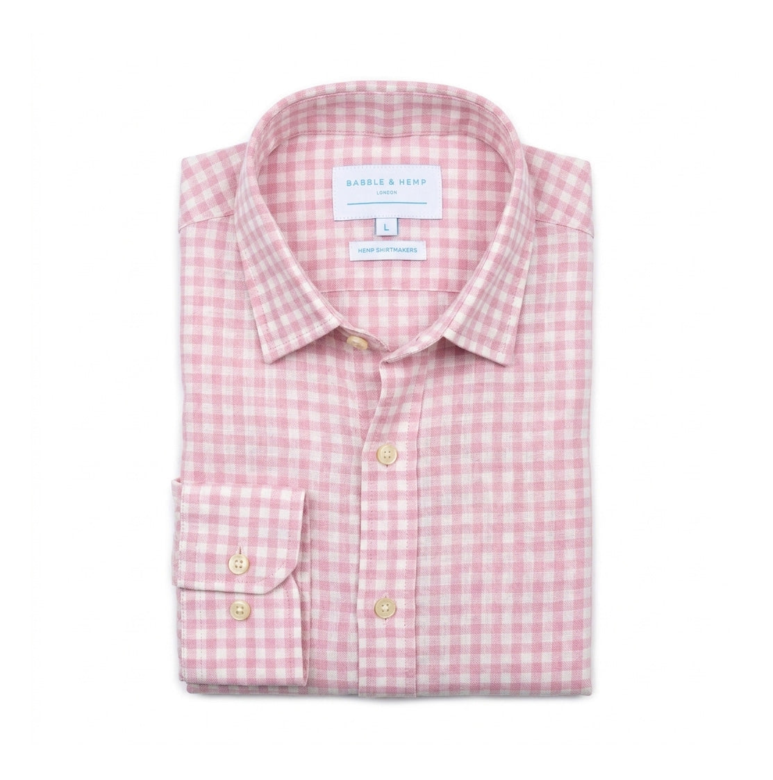 A folded long-sleeve hemp shirt by Babble & Hemp, featuring a pink and white gingham check pattern with light wood buttons and a single-button cuff.