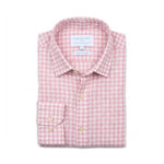 A folded long-sleeve hemp shirt by Babble & Hemp, featuring a pink and white gingham check pattern with light wood buttons and a single-button cuff.