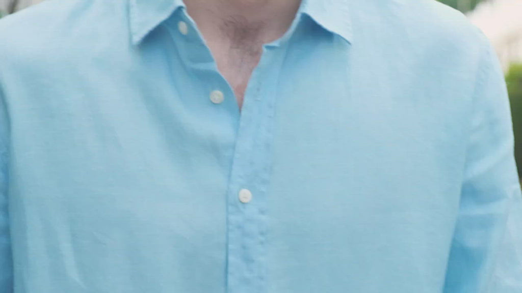 a video demonstrating a model wearing a blue hemp shirt 