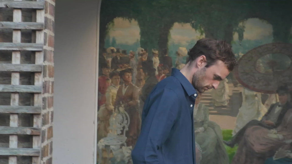 a video of a model wearing a navy blue hemp shirt