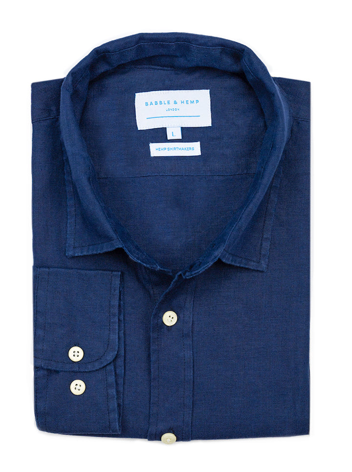 a product image from above showing a navy blue hemp shirt